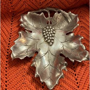 Maple leaf w/grapes,Made in India,I’ve been told it’s Pewter or Cast Aluminum